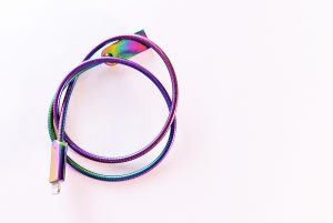Iridescent Cable Wire On White Surface